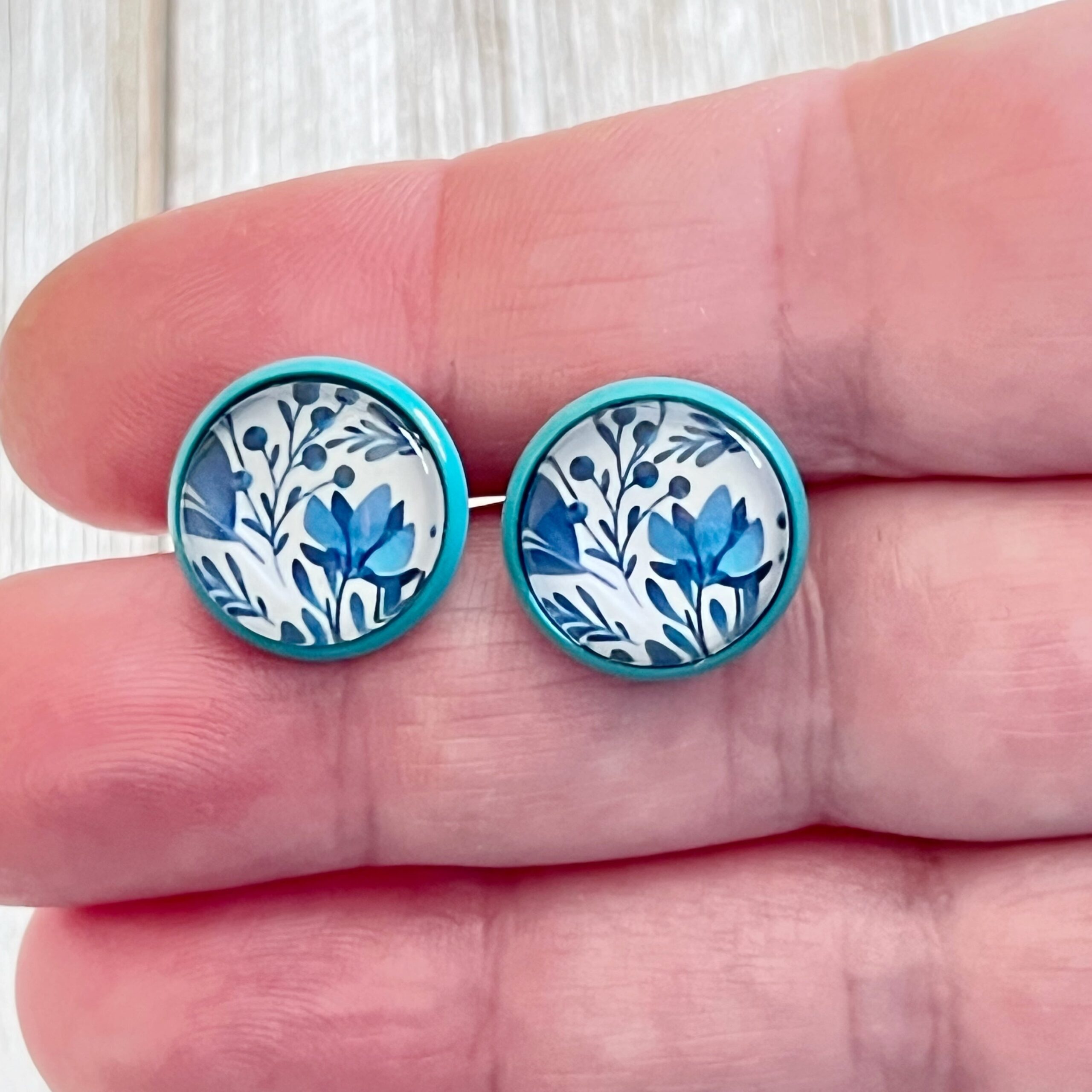 2A07C8AE-CC31-4024-83E6-16E55A5E11ED Blue Floral Stud Earrings – Round Botanical Jewelry in Teal Bezel - Image 3