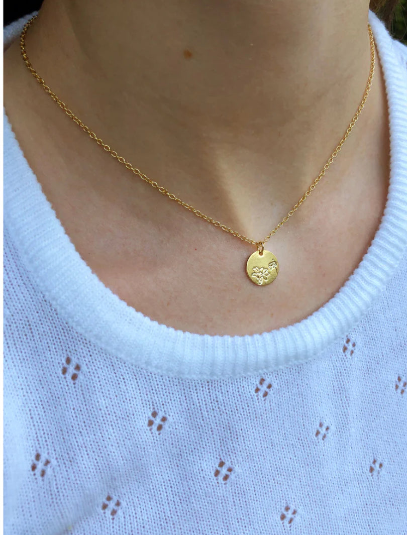 gold lily necklace on model gold lily necklace on model