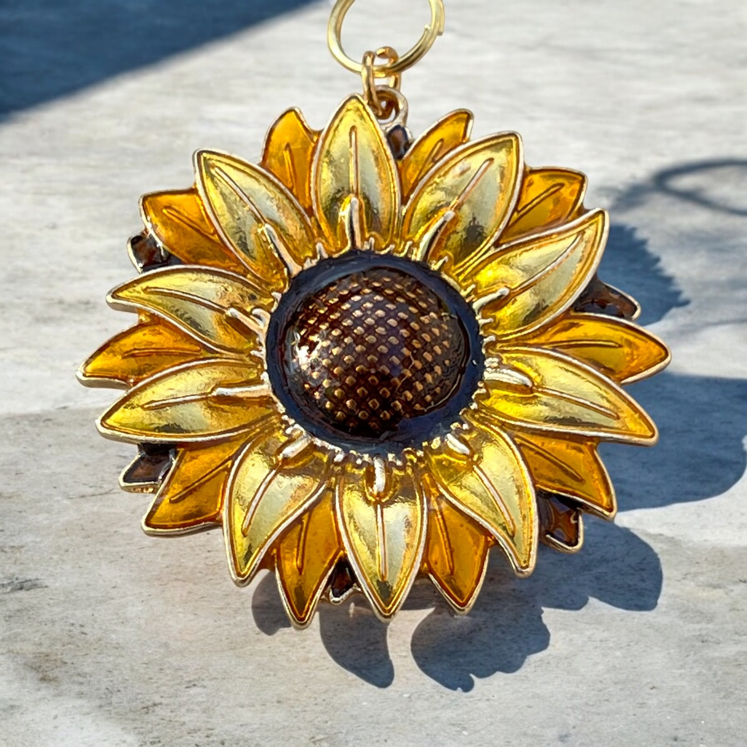 gold-sunflower-purse-charm-patterned-cloth Sunflower Purse Charm – Gold Boho Bag Accessory - Image 7