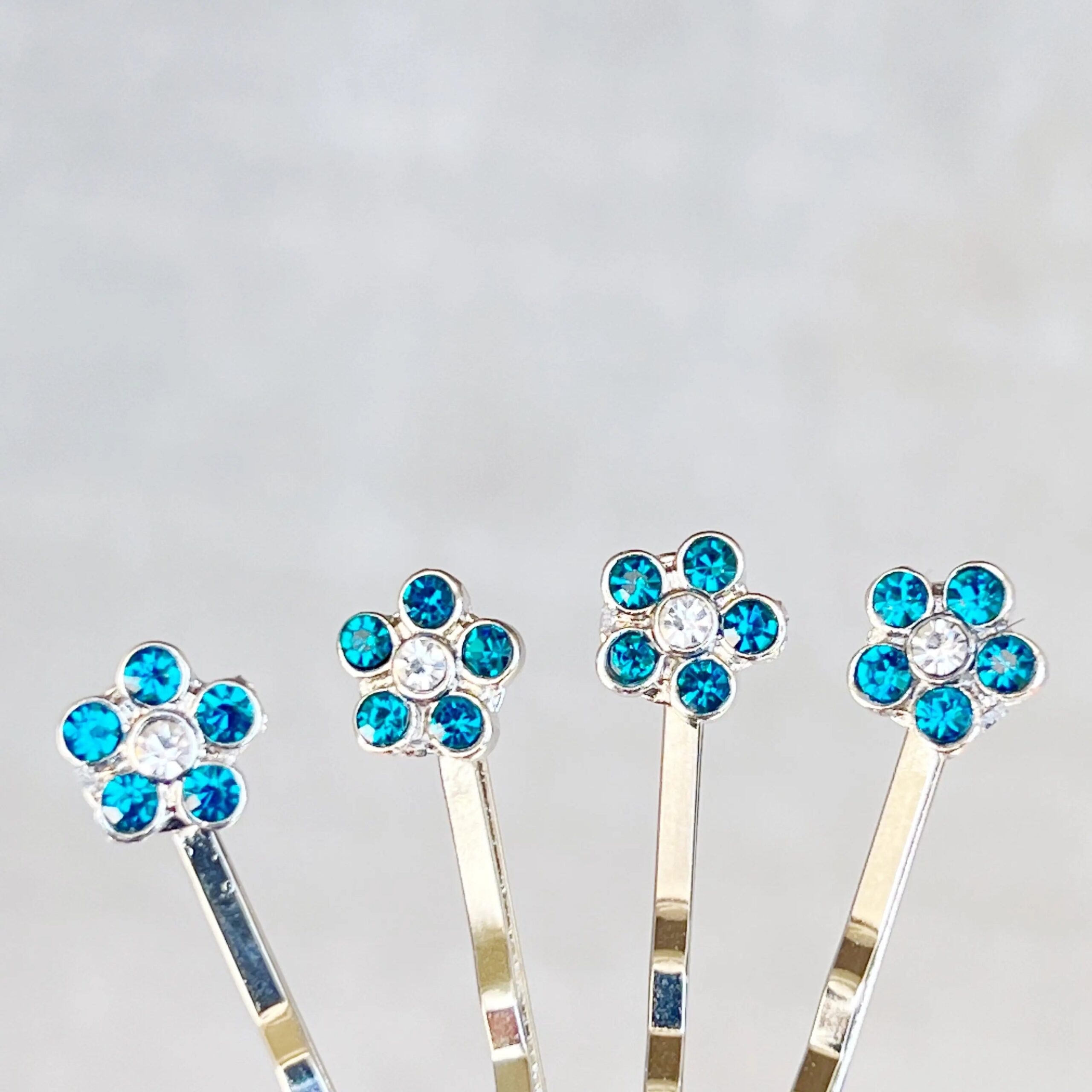 image_7723722b-9b24-49c0-b71d-95481f41c3c8-1 Blue Rhinestone Flower Hair Pins Set of 4 – Silver Bobby Pins - Image 5